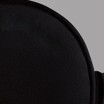 Close-up of a black fabric texture on a gray background