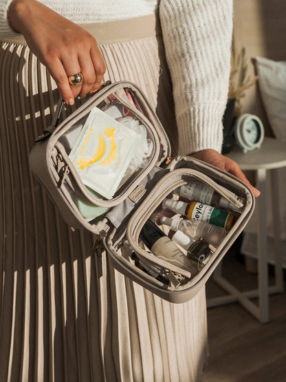 CALPAK clear cosmetics case for travel with zippered compartments; CCM2001-STONE